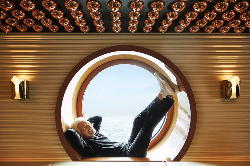 Sir Richard Branson poses in a porthole window in The Wake restaurant onboard Scarlet Lady. Sir Richard Branson Photoshoot
SCL NY Launch Event
Shoot Date: Sept 14, 2021
Usage: Worldwide/universal unlimited rights in perpetuity for all media including 3rd party usage for all footage and images captured during the shoot. Excluding TV + Broadcast. Description: Portraits of Sir Richard Branson onboard SCL.
We also photographed CEO Tom McAlpin. Deliverables: 10 Retouched images TEAM
Photographer: Peggy Sirota
http://www.peggysirota.com
Agent: Elyse Connolly CD: Christian Schrader
Art Buyer / Producer: Kathy Boos